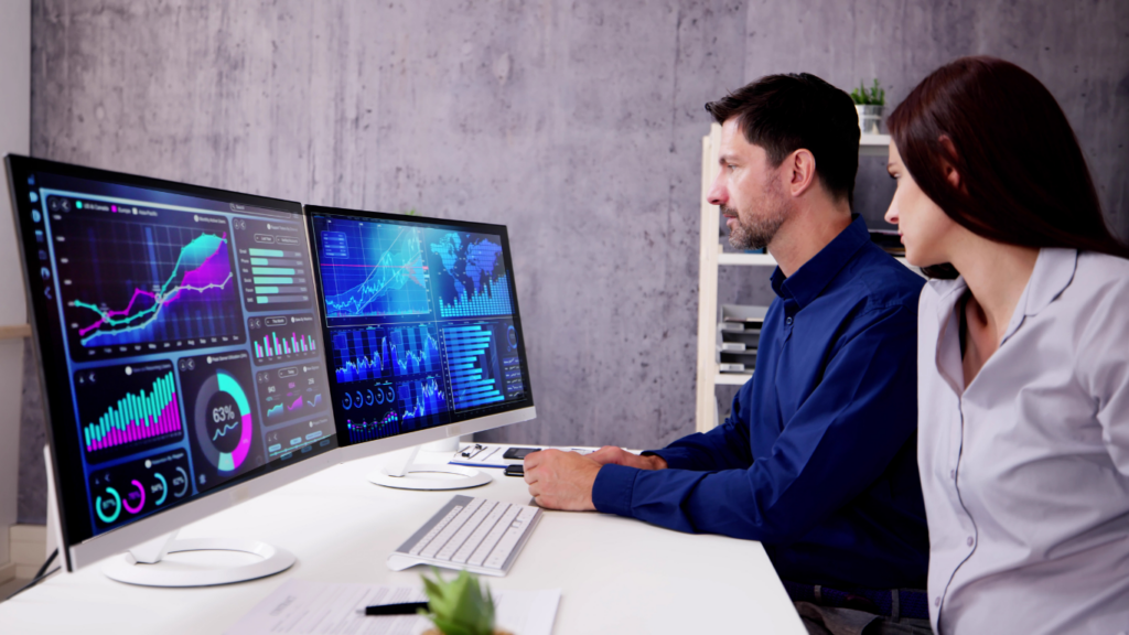 A person sitting at a desk in front of a computer 