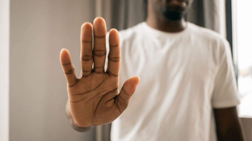 a man with his hand up in front of him