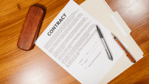 a contract on a desk with a pen