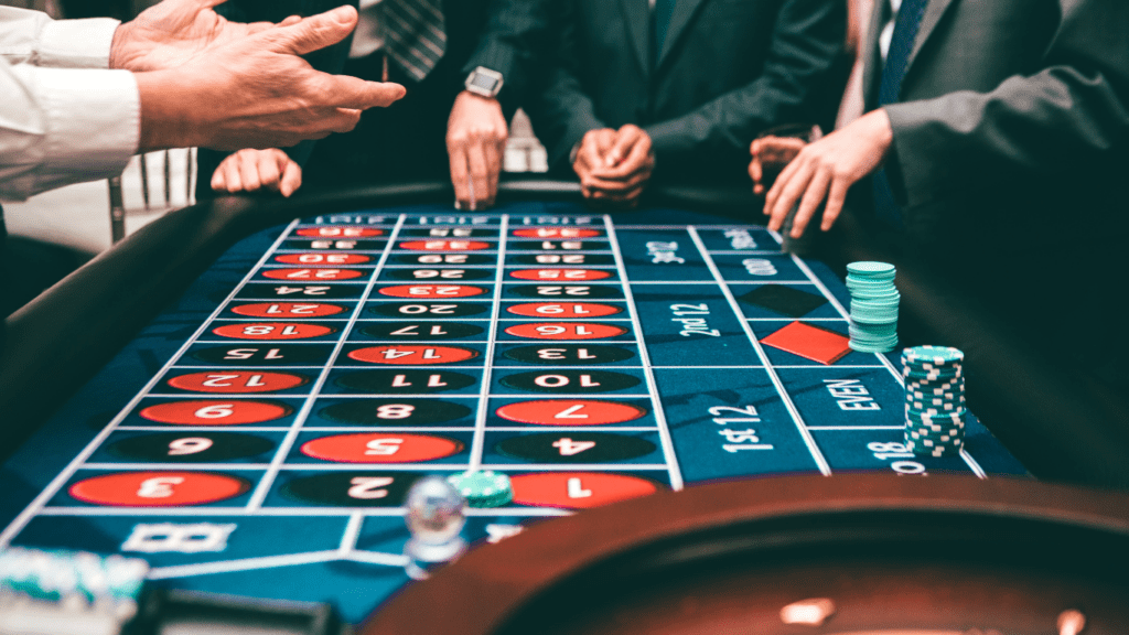 a group of people playing roulette at a casino table