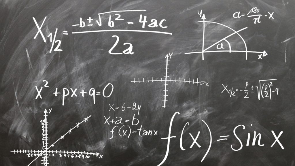 a blackboard with many formulas written on it