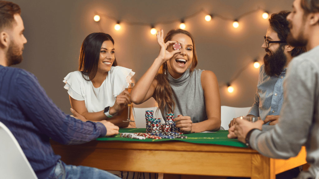 a group of friends playing poker at a casino table