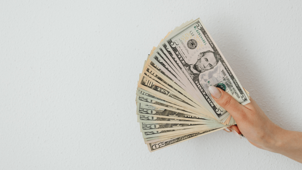 a person holding a money