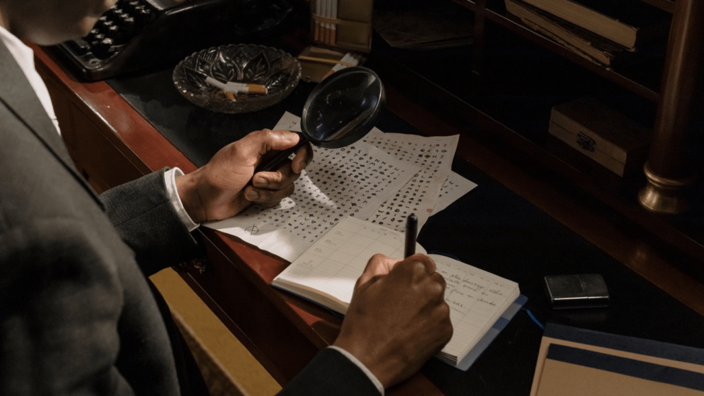 a person in a suit looking through a magnifying glass