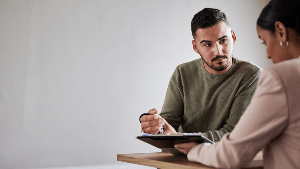 a person is using a tablet on a desk