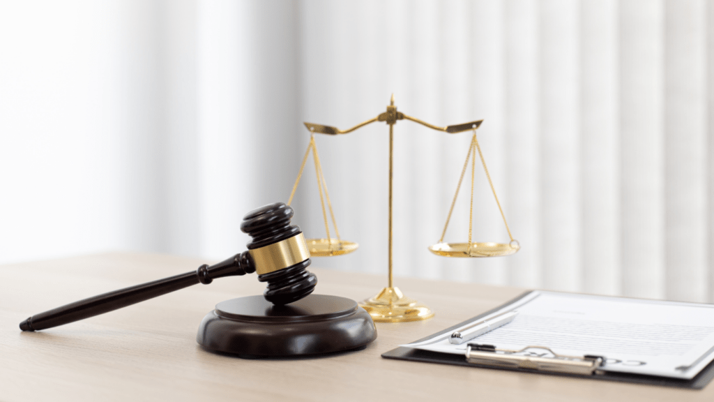 judge's gavel and scales of justice on a desk